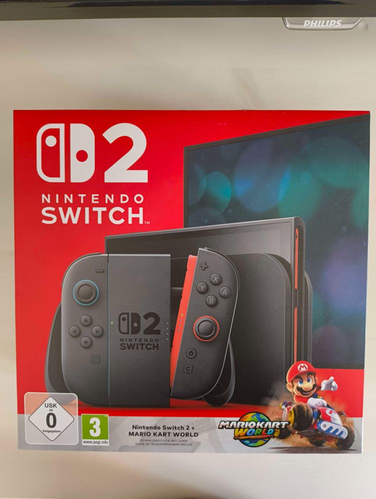 Nintendo Switch 2 European Box which has a render of Mario riding on a kart with the Mario Kart Logo next to him