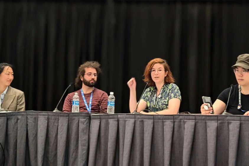 A panel featuring Chel Wong, Noa Beazley, Caio Jiacomini and Aizhou Liu.