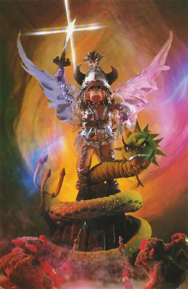 miss piggy holding a sword aloft, above a dragon 