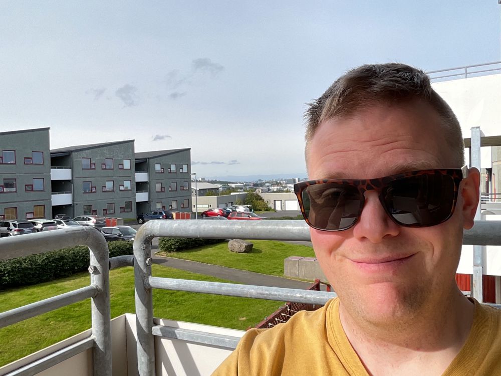 Just a hoopy frood enjoying the sun on his balcony.