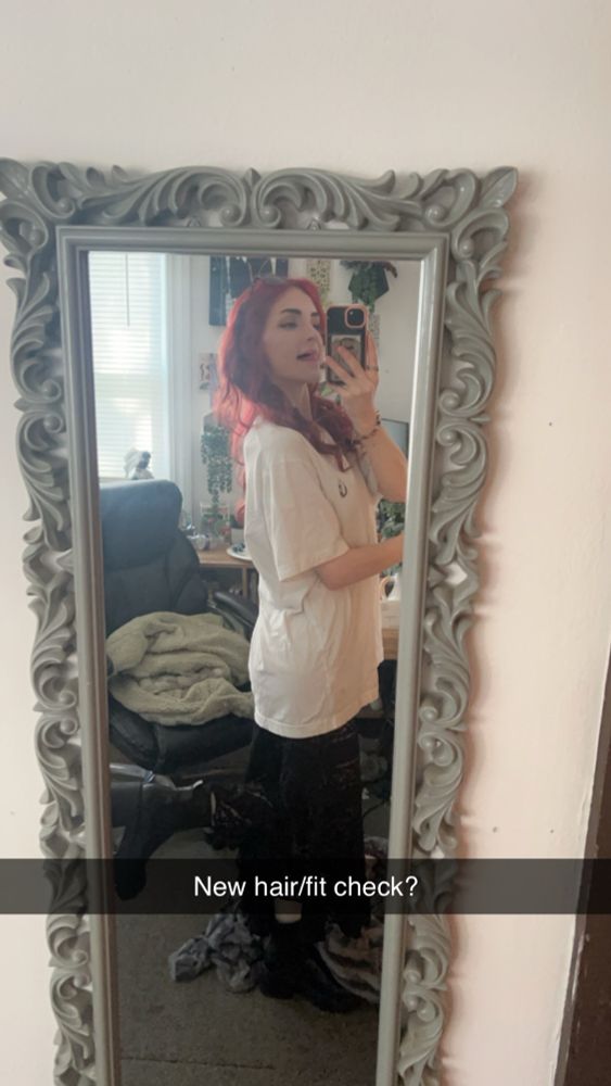 Mirror photo, long lace black skirt, oversized white tshirt, and black thick heeled boots