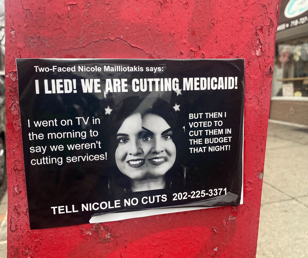 A flyer on a red street box with a two-faced Nicole Malliotakis that says “I lied! We are cutting Medicaid! I went on TV in the morning to say we weren’t cutting services! But then I voted to cut them in the budget that night! Tell Nicole no cuts 202-225-3171”