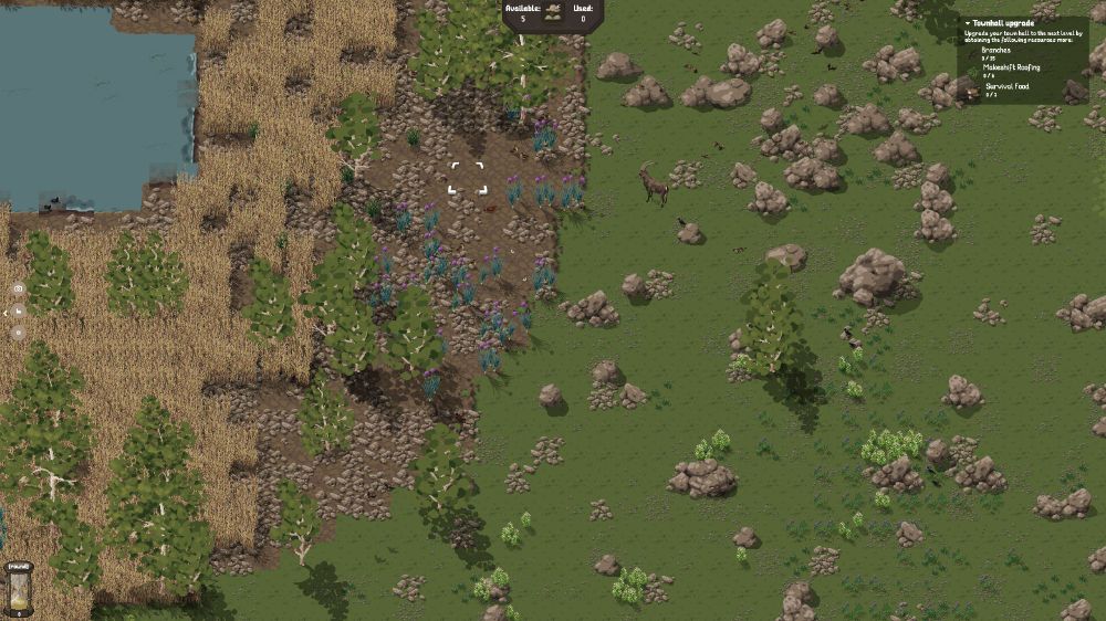 A goat stands in a field of rocks. It is heading towards a river on the right which is itself surrounded by reeds.
