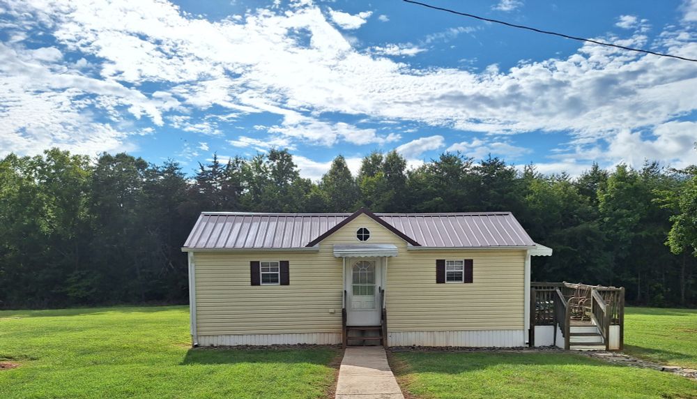 💛🏡💛 Here is a photo of our lil house. It is cute, quiet and peaceful! Although temporary, we are enjoying every day! The guard dog, I mean cat lol sits in the window on the left and growls at everyone he sees. He is probably growling at the photographer taking the photo, my son, his buddy! lol Silly boy! 😁😽💜 From hectic 🙀 to happy 😺 home!🏡 #Dexter #CatsOfBluesky 🦋😺🦋