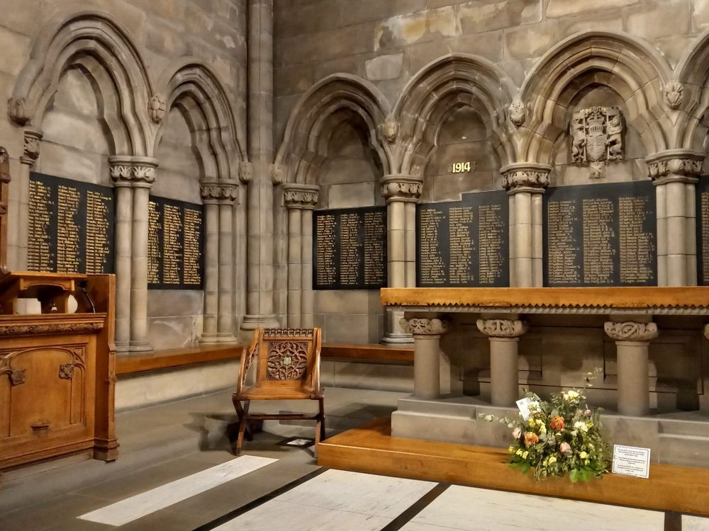 Memorial to the staff and students of Glasgow University who died in WW1. Black panels with names listed alphabetically in gold lettering, set within stone arches in Glasgow University Chapel.