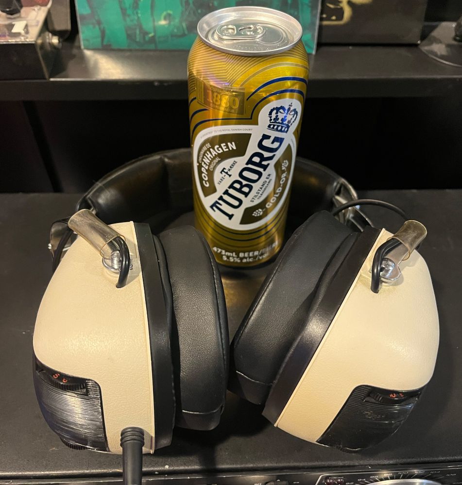 A can of Tuborg and my trusty Sansui headphones.