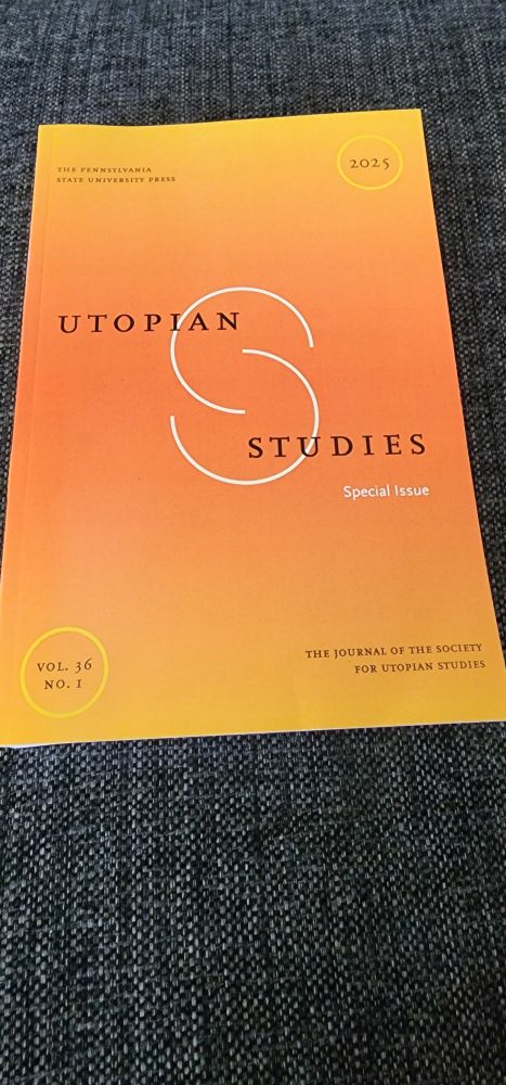 A paperback volume, the journal Utopian Studies, with its orange cover and logo