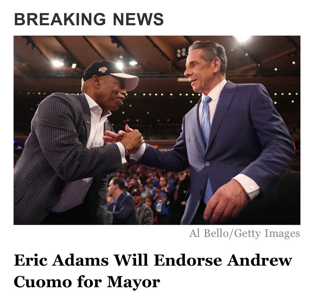 Eric Adams shaking hands with Andrew Cuomo