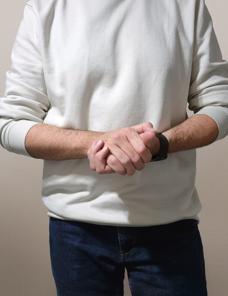 Just a photo of me. It seems like I'm hiding something in my hands. What could it be?