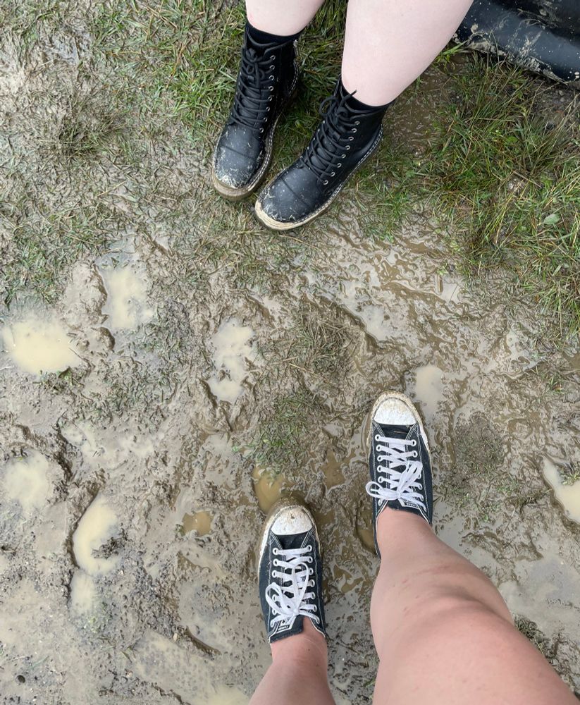 Converse and boots in mud at Inkcarceration Festival 