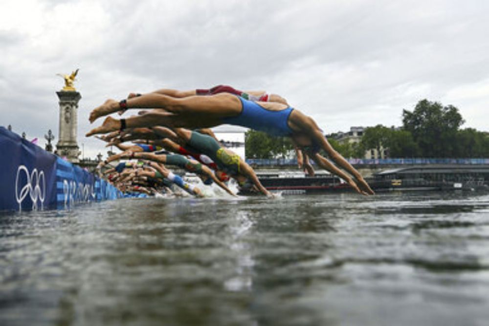 With the Seine open for business, Olympic triathletes dive in