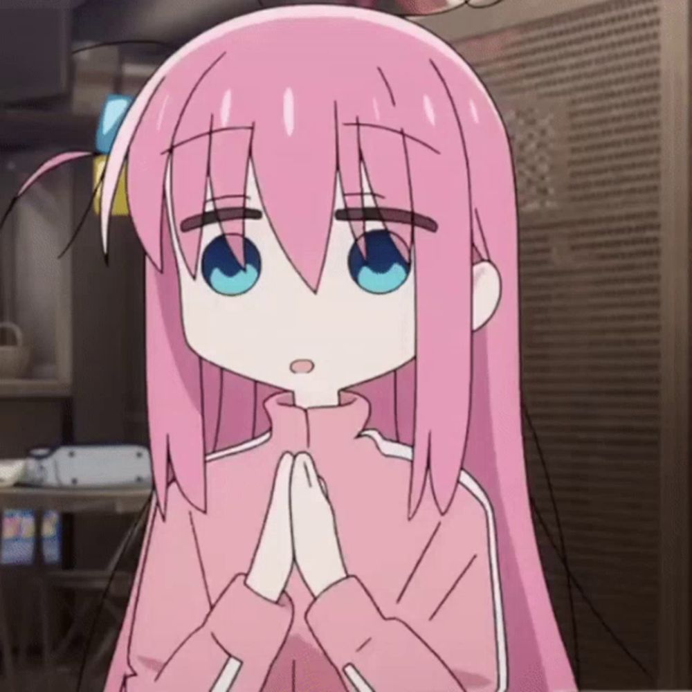 a girl with pink hair has her hands folded in front of her face