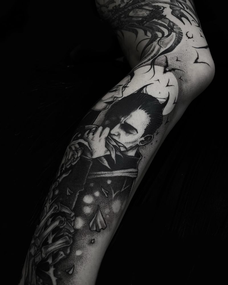 Morticia and Gomez full leg tattoo, full moon and bats in the background, skeleton hand with a rose in the foreground. 