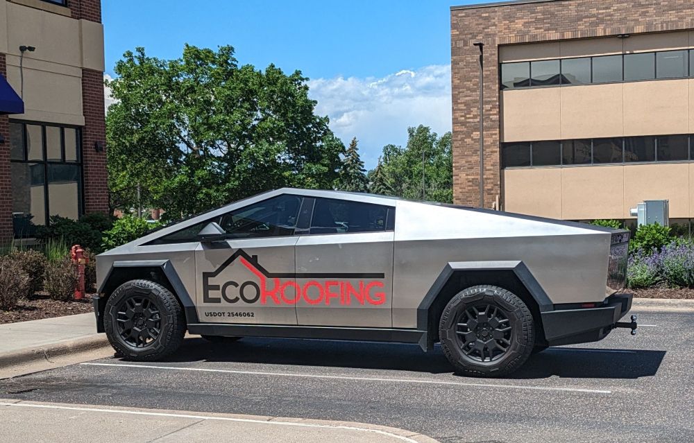 A business Cybertruck in the wild for a roofing company called EcoRoofing.
