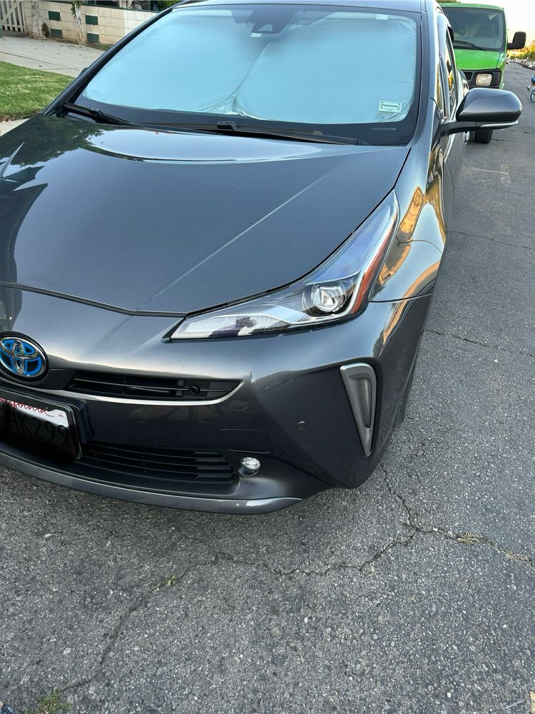 Gray Toyota Prius after front end damage was repaired. 