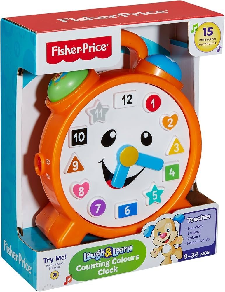 The fisher price laugh & learn counting colours clock. It is orange and in the style of an old-school round alarm clock with the little bells on top. It has a smiling face and the numbers around the dial are surrounded with different shapes and colours. 