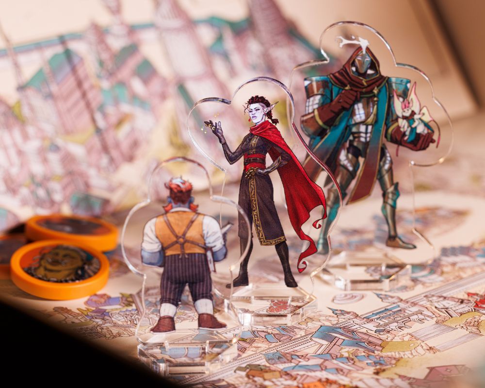 Standees posed front and back and the game board