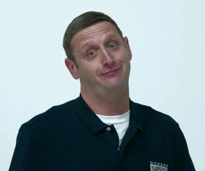 Tim Robinson making a face that gives "skeptical, disbelief, resignation, slight disgust"