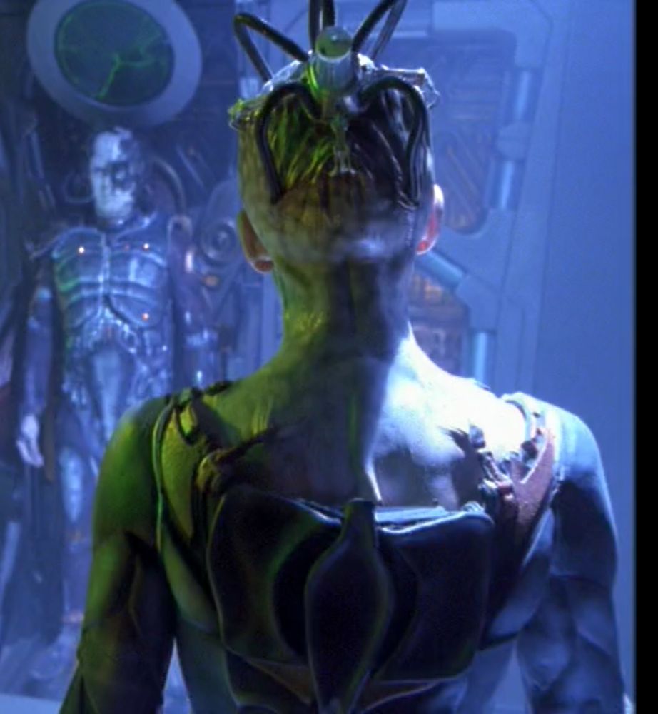 Alice Krige in the series finale of Star Trek Voyager, wearing an upside down urine sample bottle filled with LEDs on her head. absolute TV-series budget shit, maximalist (derogatory)