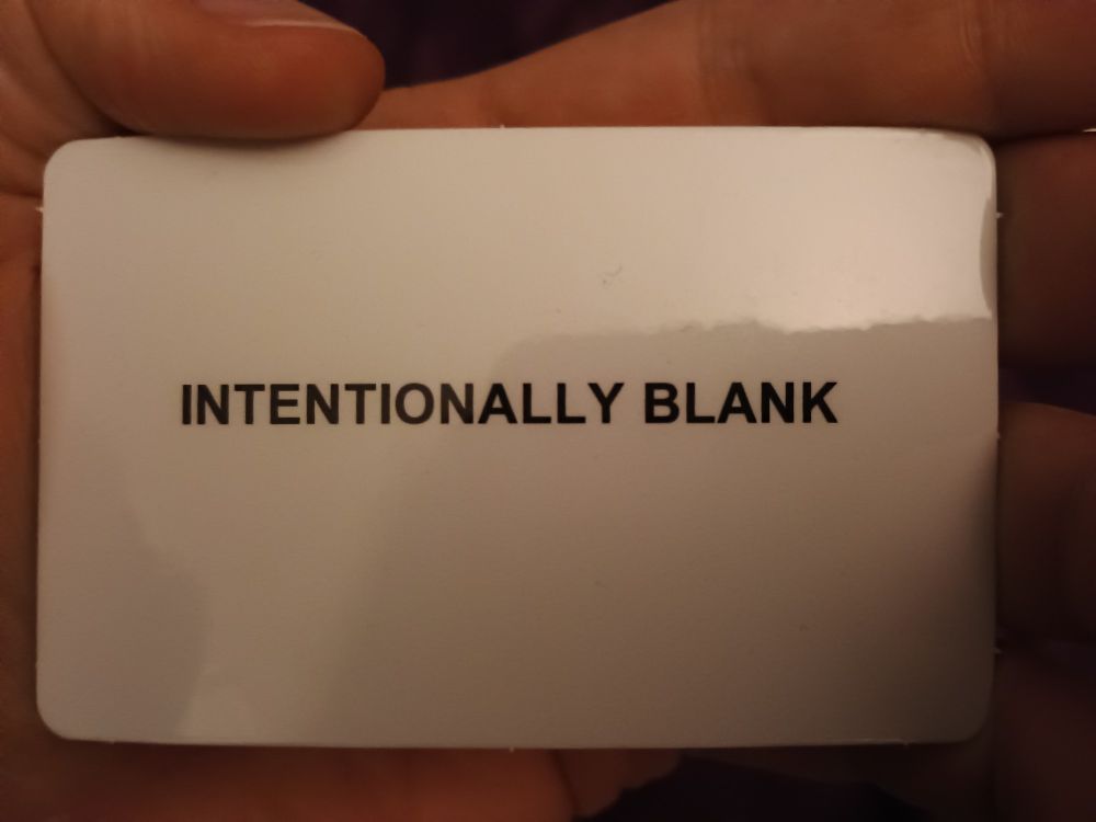 white card that says "intentionally blank"