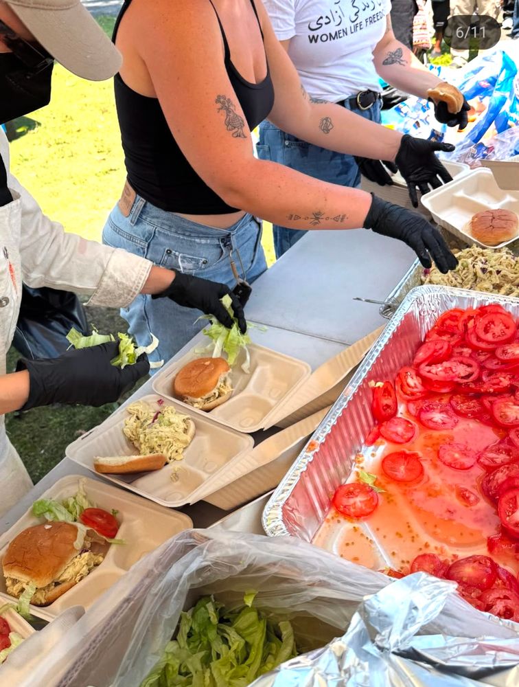 assembly line of chicken salad sandwich lunches 