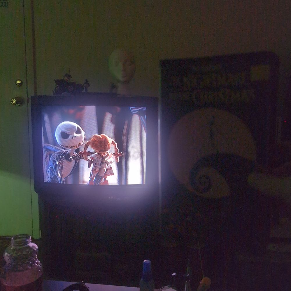 Sony Trinitron KV-27V65 CRT TV showing nightmare before Christmas Disney tim Burton. I'm holding the VHS clamshell for the movie beside the screen
