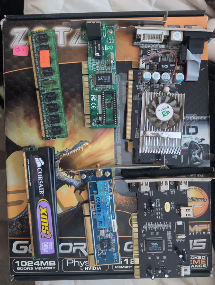 A collection of old computer cards including some epic looking Corsair ram, a low profile Nvidia, some network cards & firewire cards
