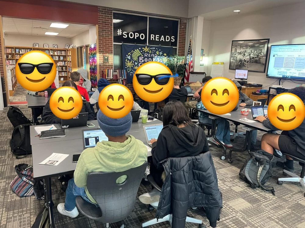 Students using computers to transcribe historical documents. 