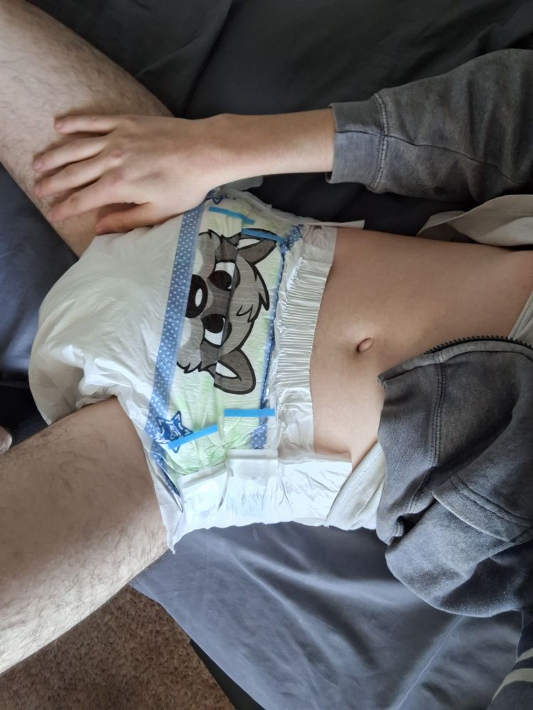 Ducky showing off her raccoon peekabu diaper