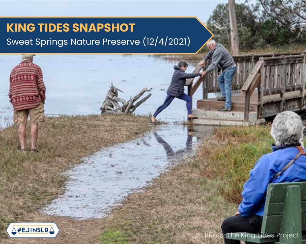 A photo of pedestrians at Sweet Springs Nature Preserve navigating pedestrian walkways after flooding from a King Tide Event. On the top left part of the slide, text in a banner reads: “King Tides Snapshot: Sweet Springs Nature Preserve (12/4/2021)”. On the bottom right of the slide, text reads: “Photo: The King Tides Project”. Hashtag logo #EJinSLR. 