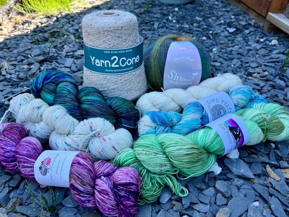 Yarn haul so far. Was happy to find that Wool in Bath carried a coned yarn that will work in my machine (Yarn2Cone 2 ply)! All of the skeins of yarn were made locally to the area where I purchased them, and the handspun was by a local gal in Glastonbury. 💕