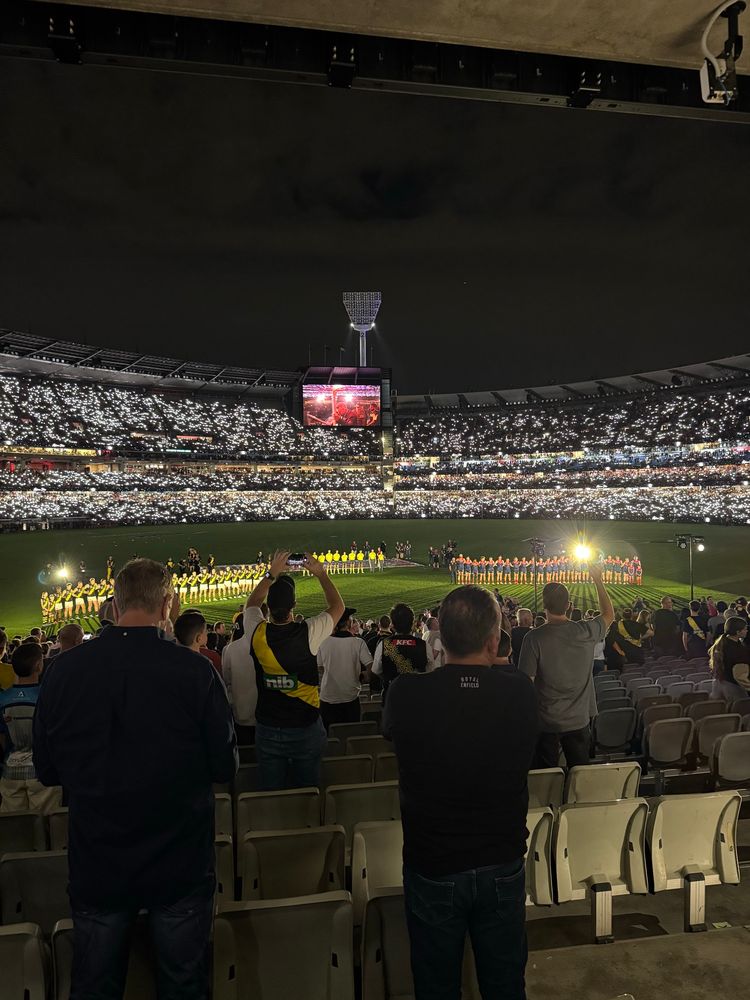 Richmond and Melbourne lined up for the pre game ceremony.