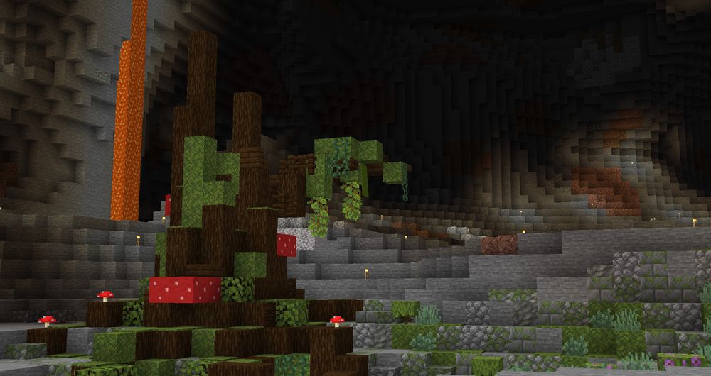 minecraft screenshot showing a big custom spruce tree covered in moss and mushrooms. the whole tree is underground with some moss and grass around it on the otherwise stone ground