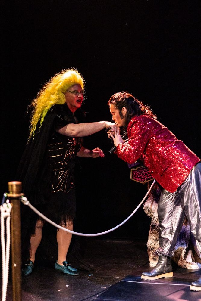 Ethel Murder, a glamor queen, is introduced to the ring by Vinny MacMan. 