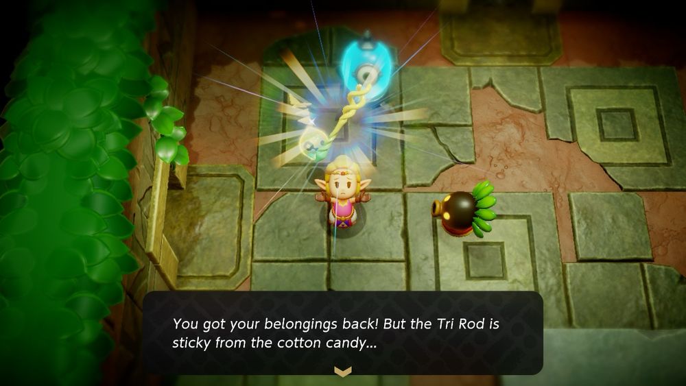 A screenshot of Echoes of Wisdom. Zelda and Tri have reclaimed the Tri Rod from a Deku scrub… but it’s sticky from the cotton candy. 