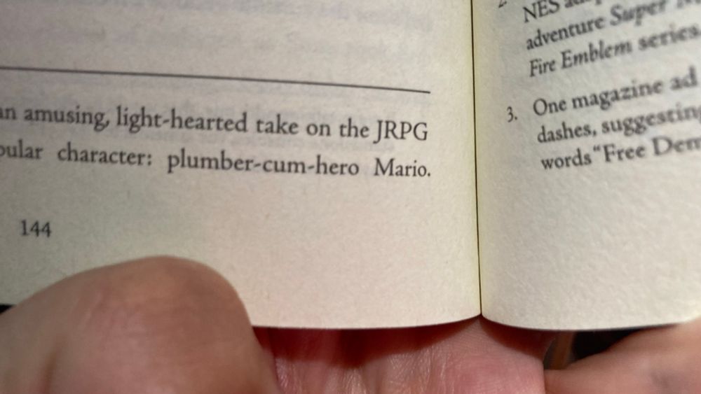 Close up of page 144 of Fight Magic Item which reads, in part, “plumber-cum-hero Mario.”