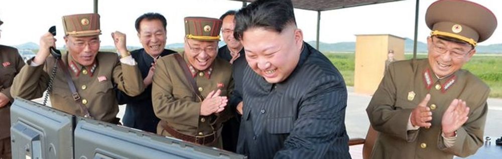 Image of N Korean leadership laughing 