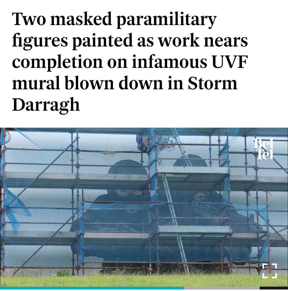 Article on the painting of a new UVF Mural in Northern Ireland with two masked gunmen.