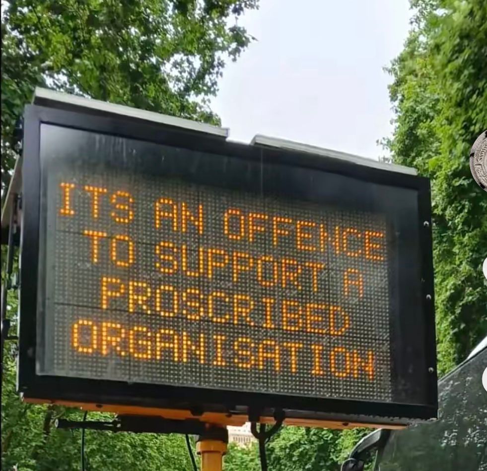 Sign that reads: It’s an offence to support a proscribed organisation. 