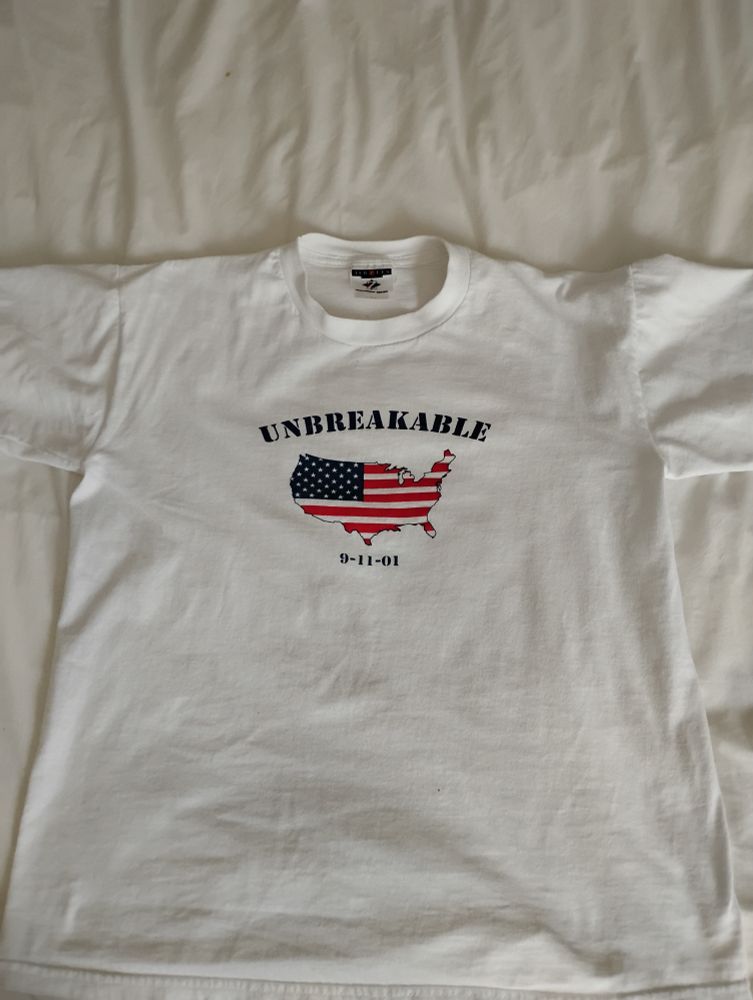 Picture of a 9-11 T-shirt that says Unbreakable 
