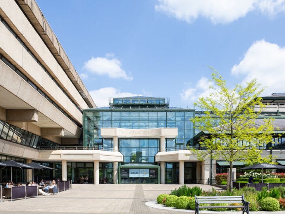 An image of the entrance to the National Archives on a sunny day