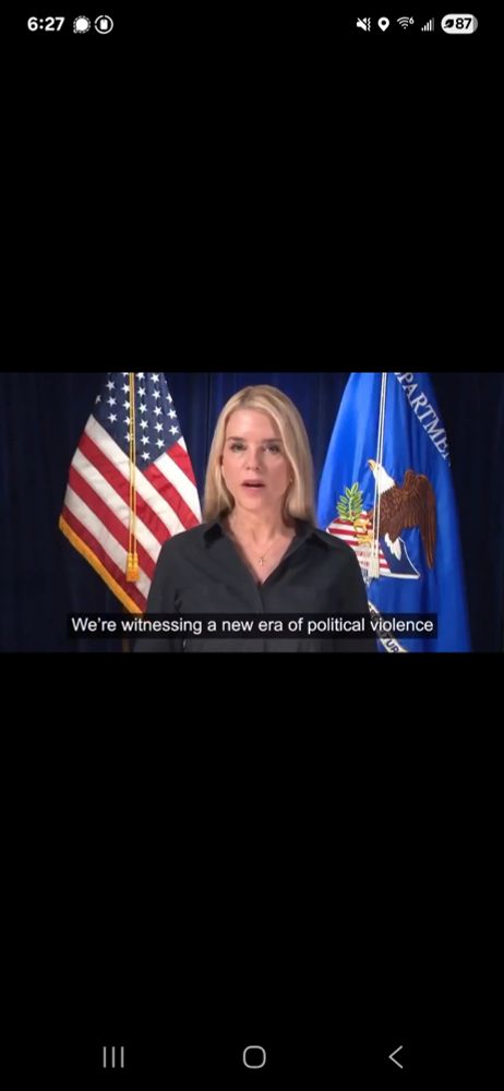 A ghoulish woman with waxy skin,  dead, vacuous eyes, and the perpetually half-agape mouth of  a mindless drunkard, Pam Bondi, stands hypocritically before the flags of the United States and the justice departmebt proclaiming that "we're witnessing a new era of political violence," like a fascist lickspittle, which she is. 