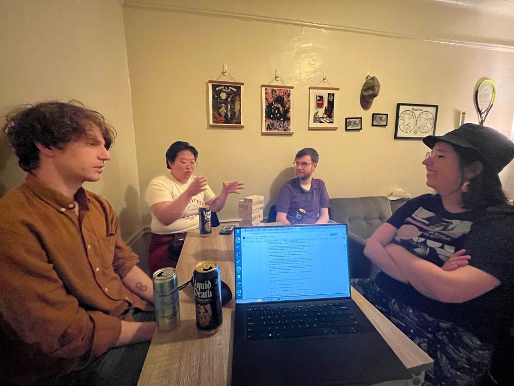 Bunch of people around a table, playing a tabletop rpg