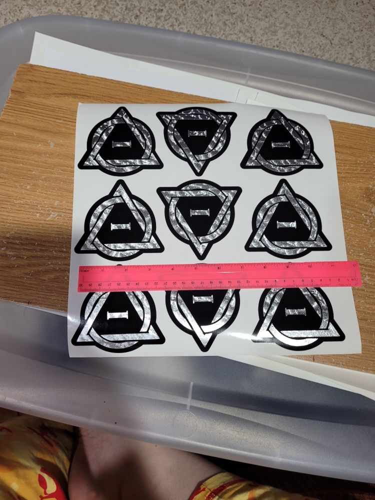 Shiny silver and black decals of the Therian emblem, made by MajikCraft.Etsy.com

Bonus ankle below.