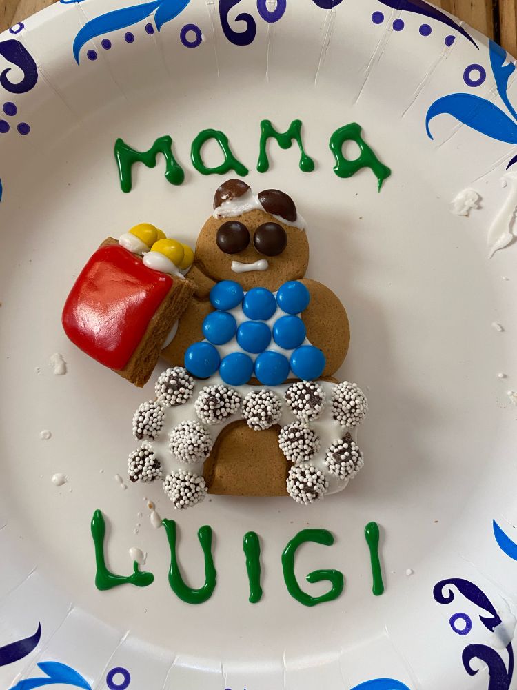 Luigi Mangione with a happy meal, but it’s a gingerbread man version