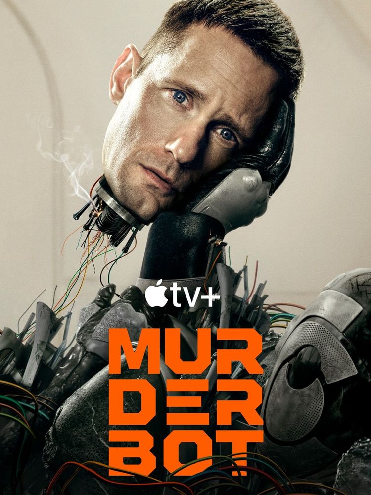Poster for Murderbot tv series, shows murderbots head, torn from his body, held aloft by his hand, above a pile of broken robot parts. He has no helmet and looks sad. 