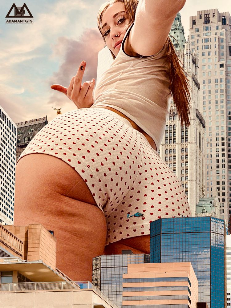 Goddess Crystal towers over a city, her perfect ass looming over buildings, she gives you the middle finger as you can’t help but gasp and wish you could ever reach her.
