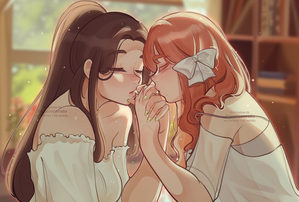 two young women with their hand intertwined, wearing wedding rings, they're kissing each others ring, they're in a room light up by the sunset, one of them is a white brunette girl and the other is an asian with hair dyed red, both are dressed in white 