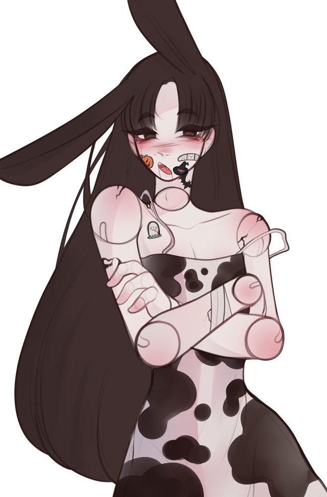a young girl wearing a long dress, with really long hair and halloween stickers on her face, her body is painted as a fully articulated puppet 