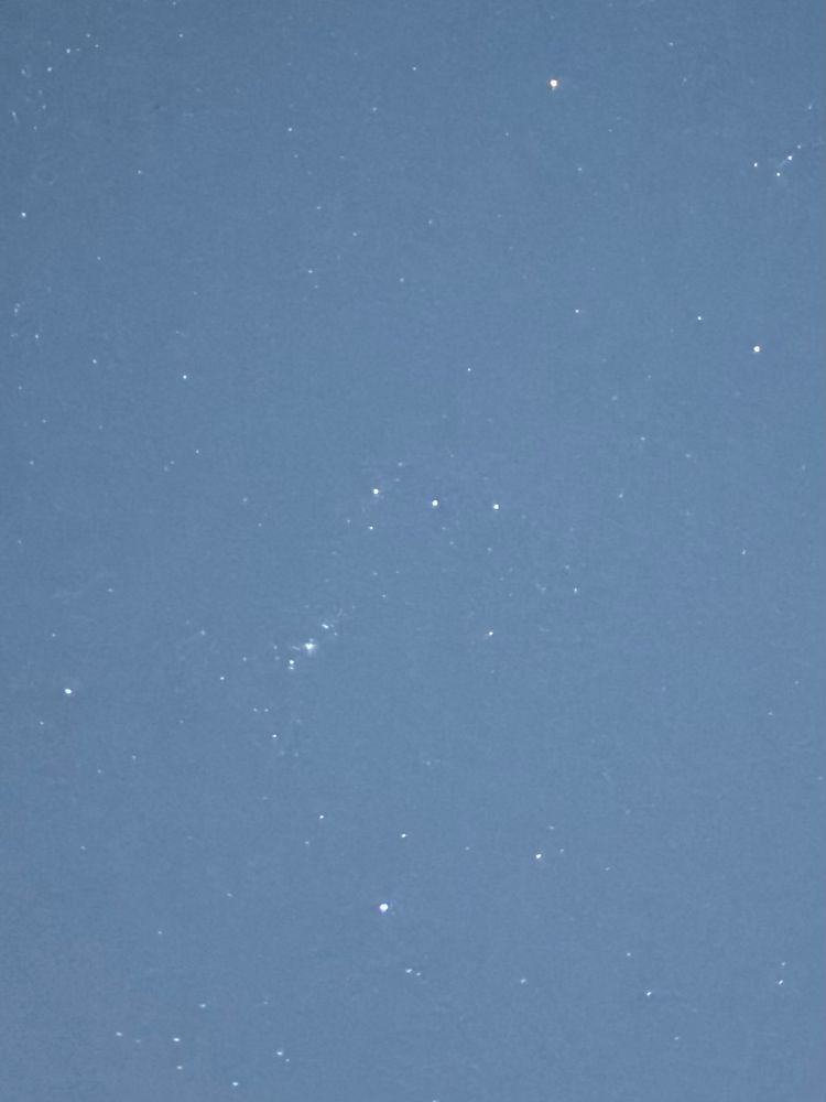 A picture of Orion’s Belt in the blue night sky